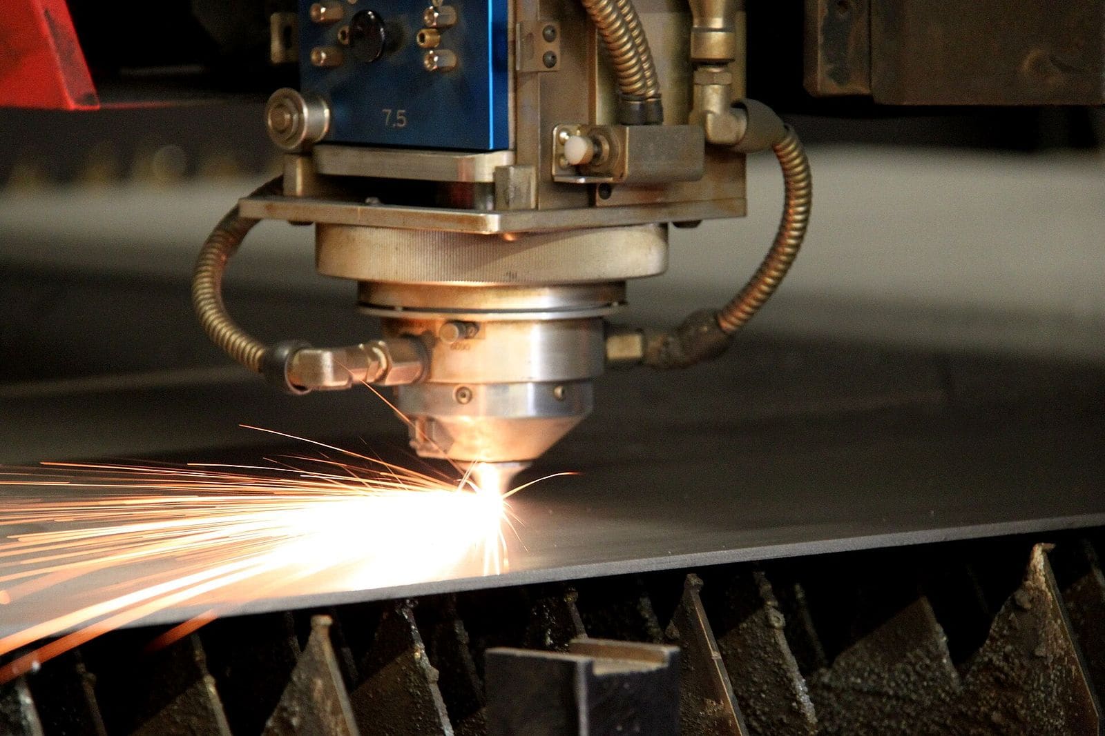 The 60KW cutting head driving a kerf through steel plate