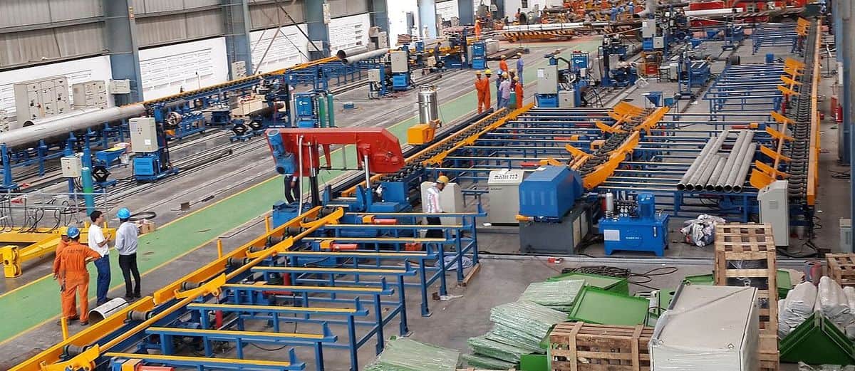 Steel pipe stock loaded onto the roller feed line ahead of the tube laser